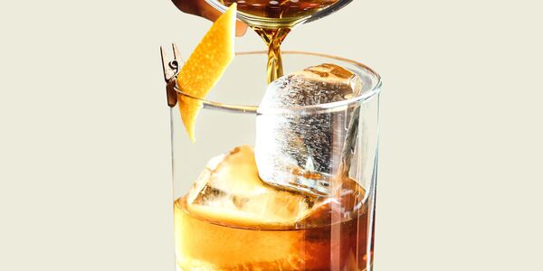 Cup of herbal tea on a wooden surface